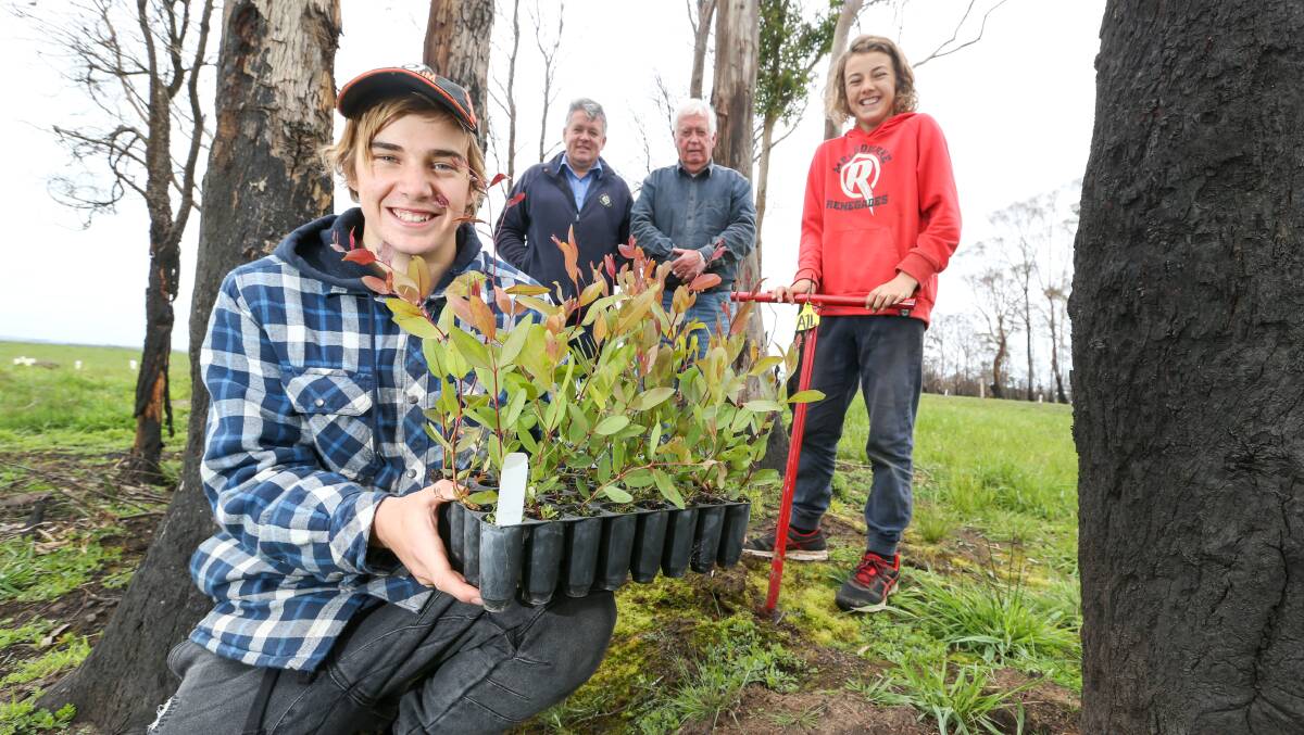 Green start: Ed and Fraser, right, Guthrie of Glenfyne with the Heytesbury Landcare Network's Geoff Rollinson and their grandfather Bill Guthrie near an area that has been revegetated on their farm. Picture: Michael Chambers