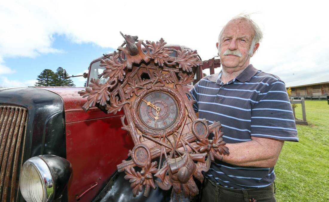 Valuable: Bruce Lowenthal with his 1900 German hand carved Black Forest Cuckoo clock.