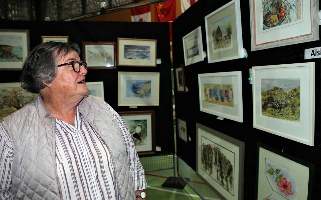 PICTURE PERFECT: Rotary Club of Warrnambool East volunteer Ruth Barratt is ready for the annual City of Warrnambool Art Show which will be open all weekend.