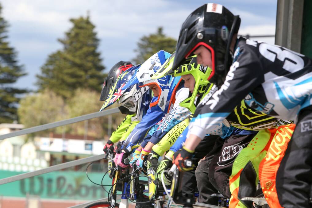 Race mode: The junior riders focus before hitting the track for their race on Sunday. Picture: Michael Chambers