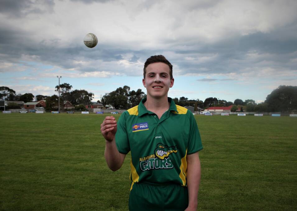 HOT FORM: Allansford's Damon Dews poses with the ball he used to claim five wickets in the Gators' victory. Picture: Sean Hardeman