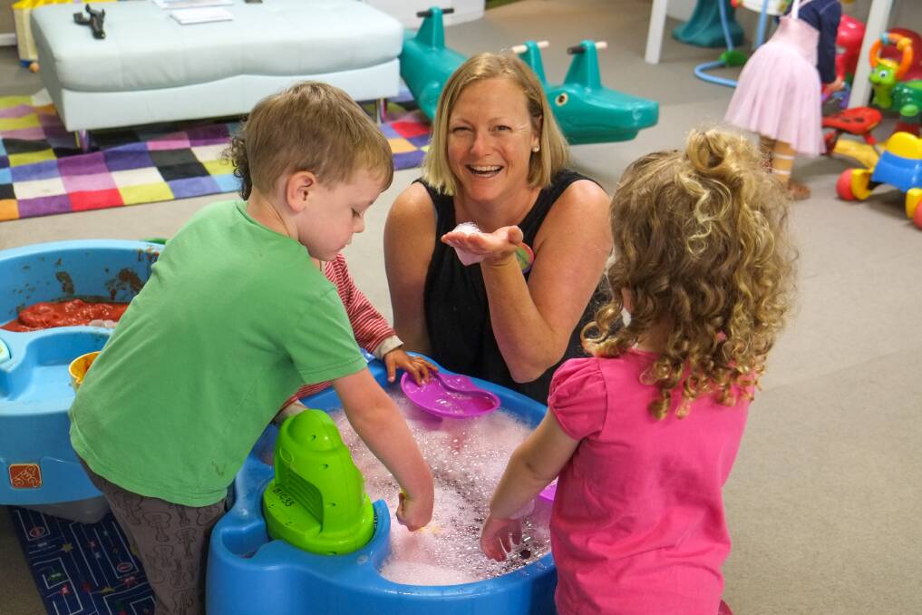 Getting messy: Messy Play Day event coordinator Bonnie Lucas blows some bubbles with Fletcher Lucas, 4, William Malabar, 2, and Annabel Hatton, 3. Picture: Rob Gunstone