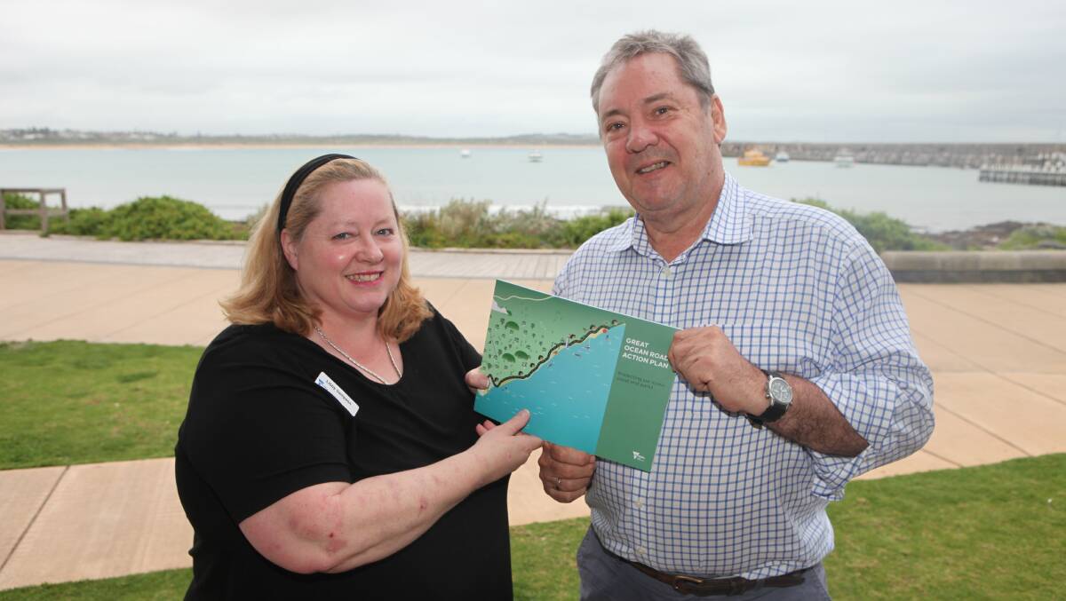 Great Ocean Road Taskforce project leader Libby Sampson with taskforce member Bruce Anson and a copy of the GOR Action Plan.