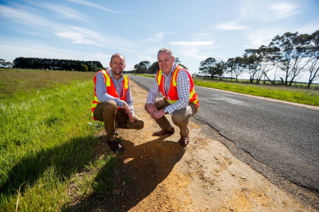 WORKS BEGIN: Regional Roads Victoria's south-west regional director Mark Koliba and chief regional road officer Paul Northey inspect the Warrnambool-Caramut Road. Picture: Morgan Hancock