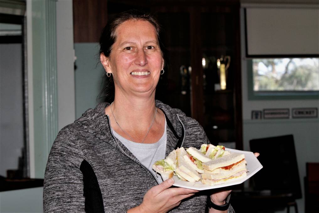 IMPORTANT ROLE: Hawkesdale's Jackie Cozens makes sure the players are well fed at the tea break. Picture: Anthony Brady
