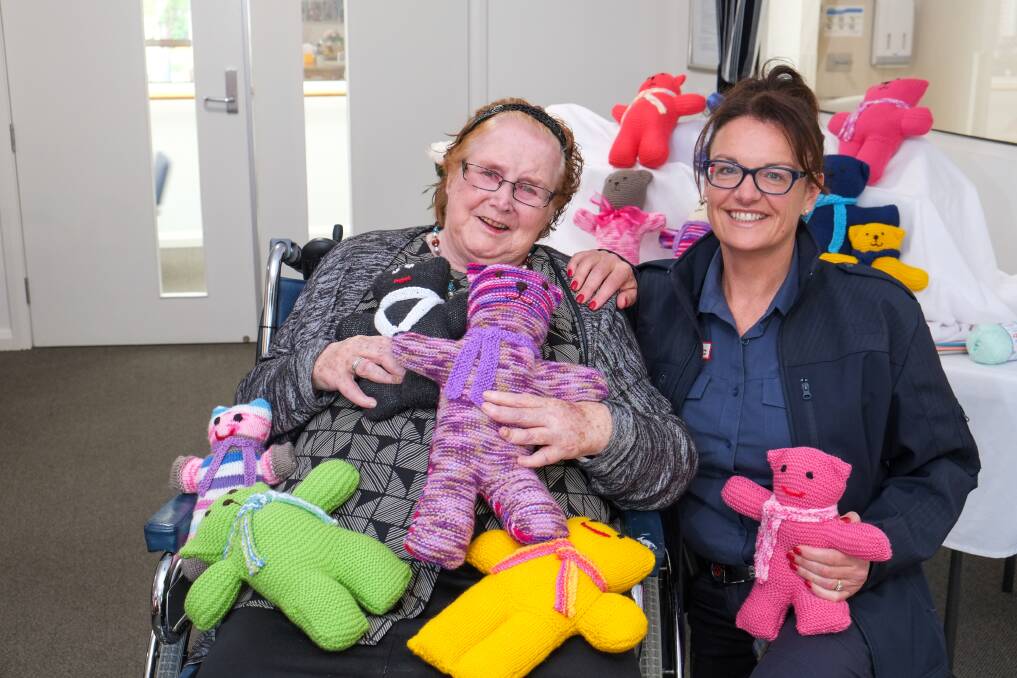 Comforting: Mercy Place resident Annette Brebner with Warrnambool ambulance paramedic Jo O'Connor-Ward and some of the knitted trauma teddies. Picture: Rob Gunstone