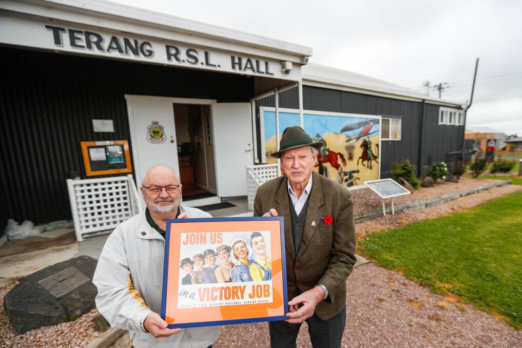 On track: Terang RSL president Steve Bloxham and WWII veteran Len Pomeroy with one of the posters that will be displayed on a W-Class tram. Picture: Morgan Hancock