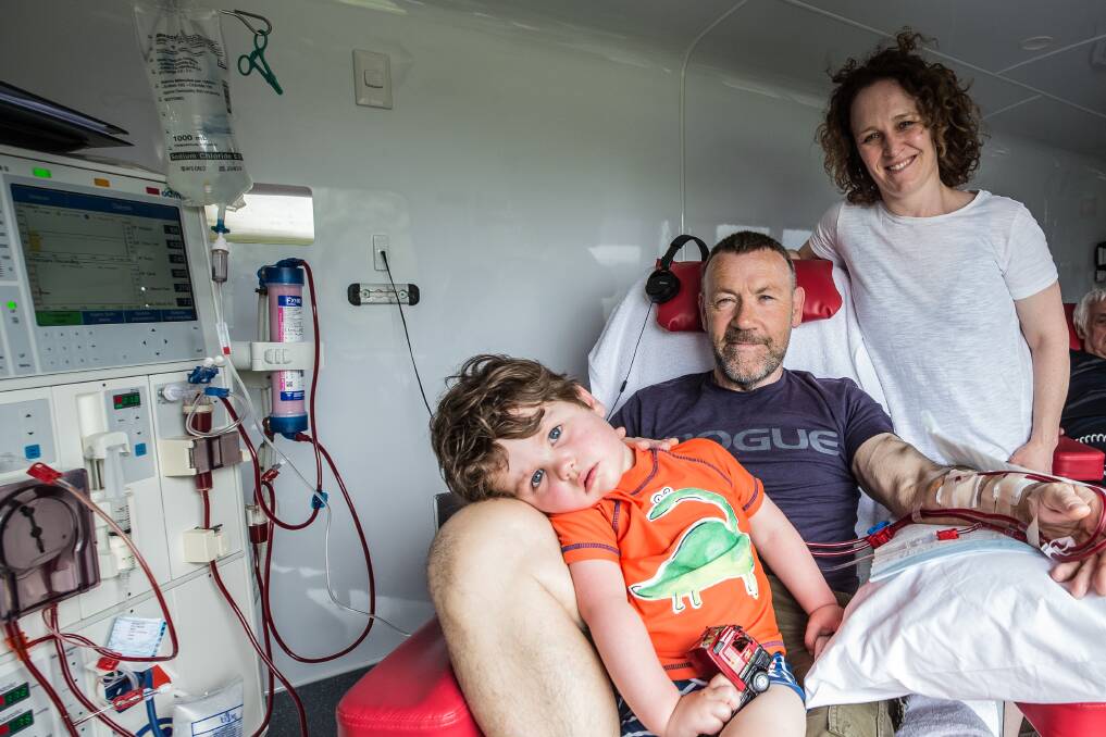 All aboard: Mark, Rebecca and Evan Pullinger, 2 are visiting Warrnambool thanks to the Big Red Kidney Bus. Picture: Christine Ansorge