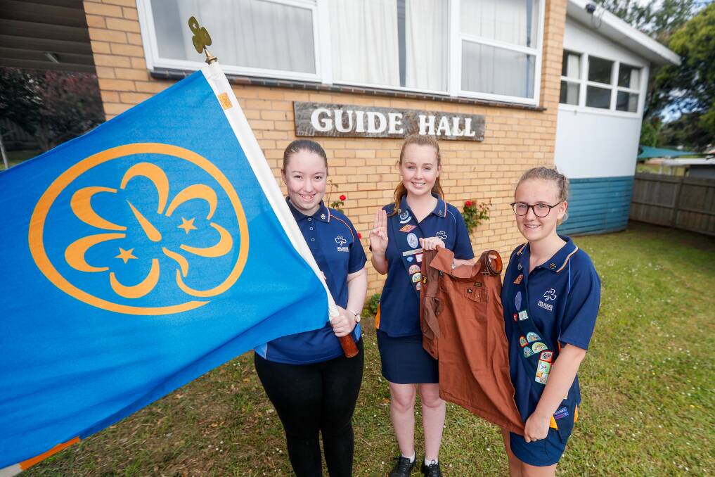 Oath: Warrnambool Girl Guides Alissa Holmes, 18, Anastasia Rea, 15, and Emily Ward, 15, will be showcasing the group's history at its 90th anniversary on the weekend. Picture: Morgan Hancock