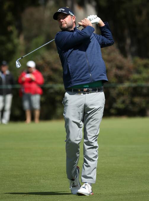 RIGHT AT HOME: Victorian golfer Marc Leishman made a solid start to his World Cup of Golf campaign in Melbourne on Thursday. Pictures: AAP 