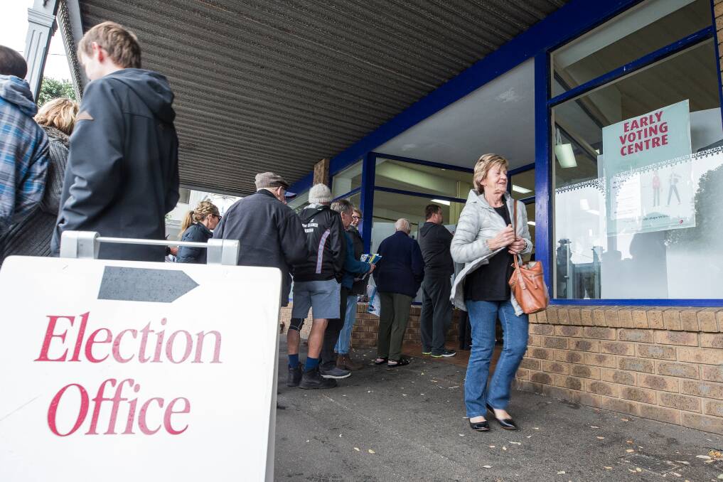 Pre-polling: Voters line up at the early voting booth the day before the Victorian elections. Picture: Christine Ansorge