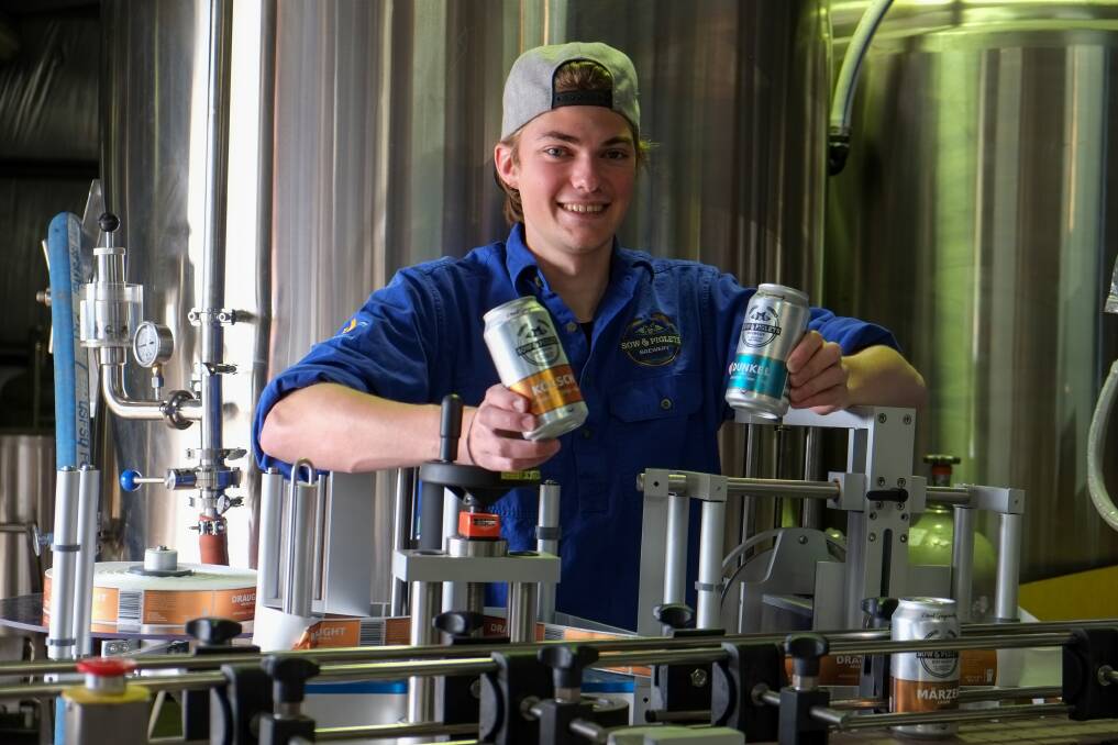 Taking a new line: Young German beer brewer Moritz Dammert with some of the newly labelled cans at the Sow and Piglets Brewery. Pictures: Rob Gunstone