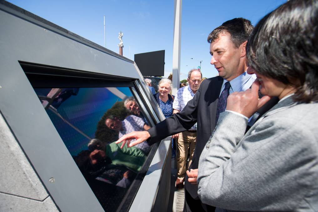 Warrnambool RSL historian David McGuiness demonstrates the new interactive war memorial.