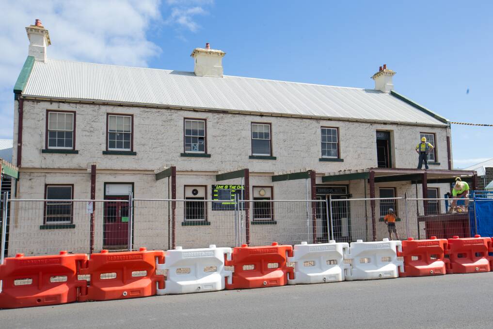 Going, gone: The owners of the Royal Oak Hotel in Port Fairy, formerly the Commercial Hotel, removed the building's verandah last week after it was deemed unsafe in February. Picture: Christine Ansorge