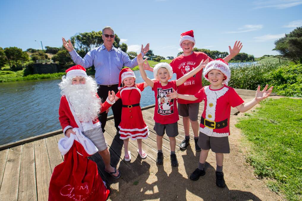 Christmas cheer: St Johns Dennington students Jacob Hose, 8, Lily Hose, 6, Scout Van Der Heyden, 6, Mitchell Crothers, 7, Joseph Hose, 12, and Carols by the Merri organiser David Kelson are looking forward to this Friday's event. Picture: Christine Ansorge