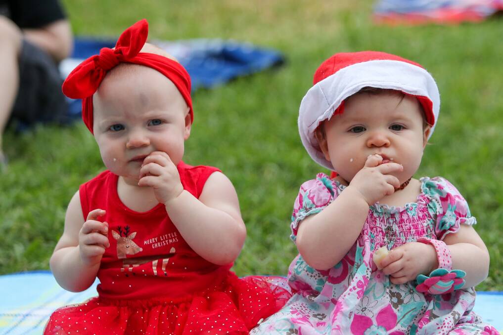 Stuffed: Ten month old friends Indianna Inns and Matilda Sinnott are unsure what all the fuss is about this time of year but are happy to eat their way through Christmas. Picture: Morgan Hancock