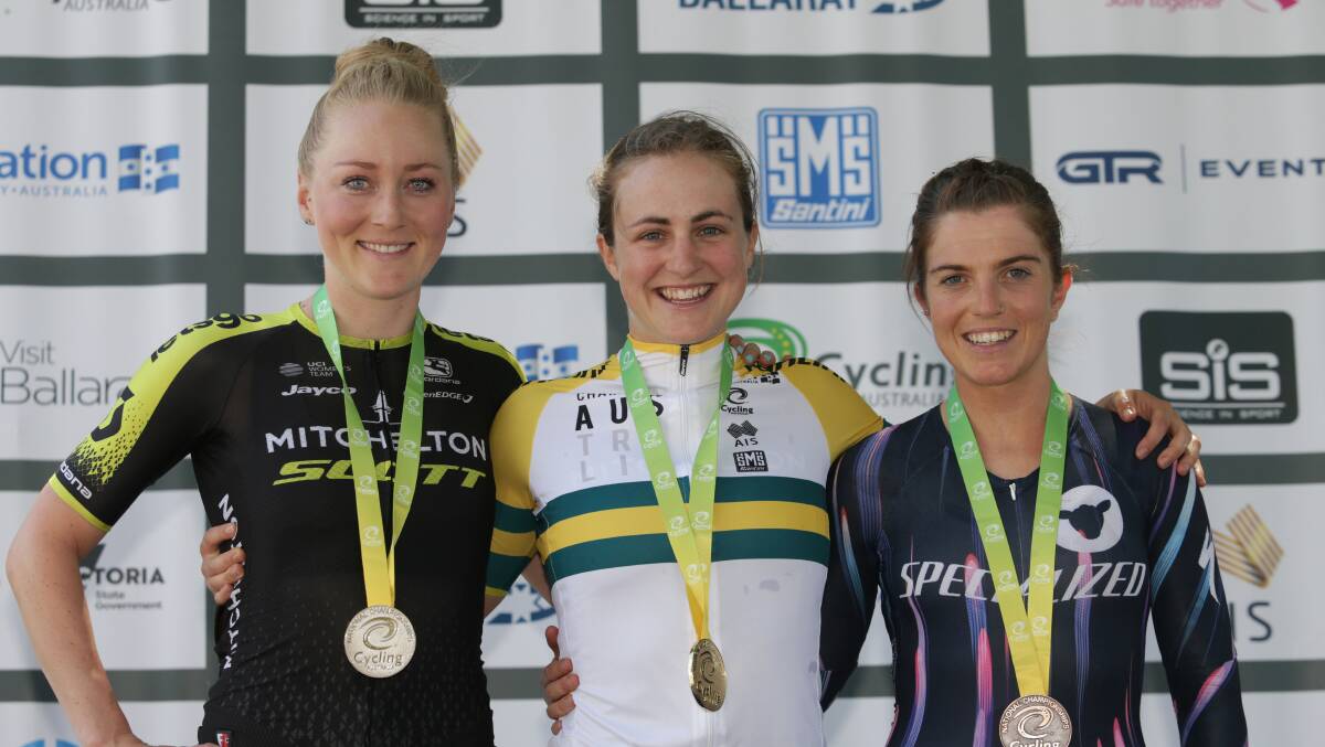 GREEN AND GOLD: Grace Brown (middle) stands atop the podium after winning the Australian time-trial title. It was one of her first wins with Mitchelton-SCOTT. Picture: John Veage