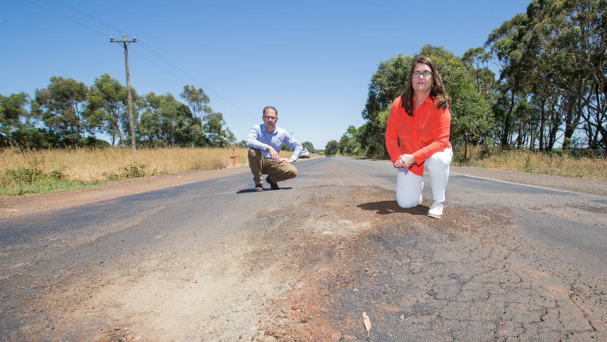 Road trauma: Polwarth MP Richard Riordan and South West Coast MP Roma Britnell next to a giant pot hole located on Timboon-Colac Road, near the Simpson Speedway. Picture: Christine Ansorge