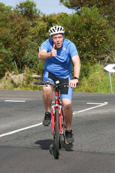 Thumbs up: Allansford's Peter Gaffy departing on his mountain bike for the cycle leg at the Blue Hole Mini Triathlon in January.