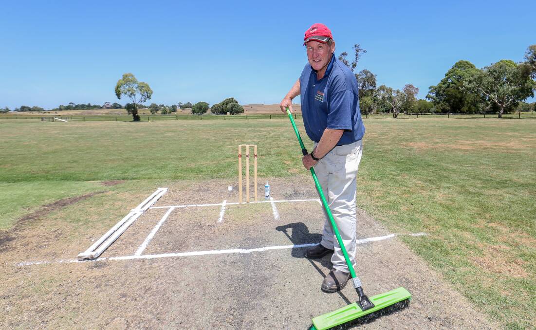 Terang Cricket Club curator Colin Venn tends to the pitch before the start of the SWC final. Picture: Christine Ansorge