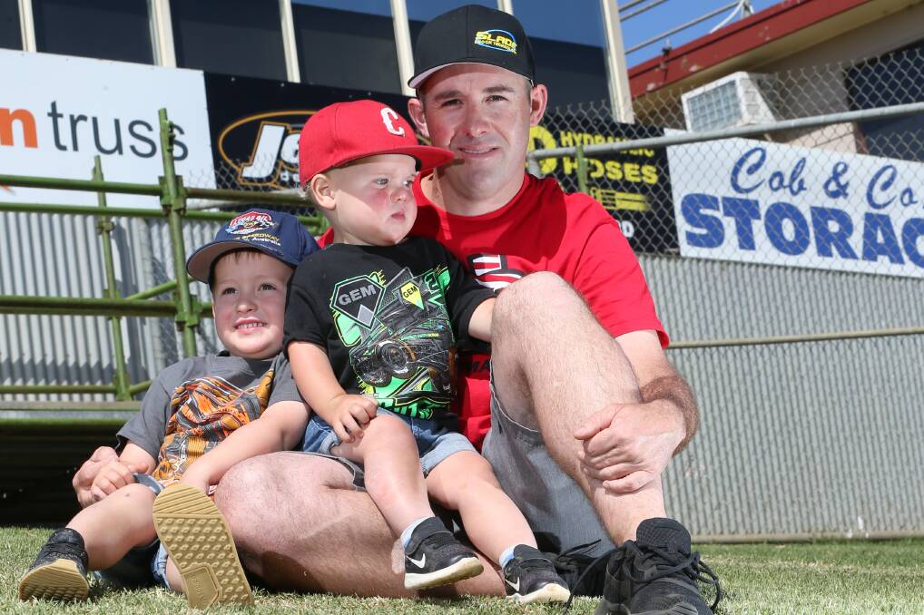 FAMILY FIRST: Crew chief Glen Beaton with sons Cade, 3, and Cole, 1. The pair already love the speedway like their dad. Picture: Michael Chambers  