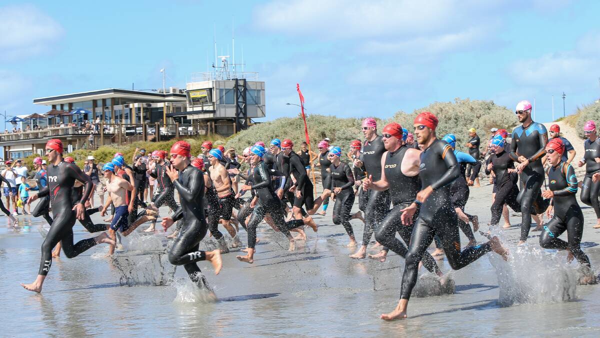 FIRST IN: Competitors in last year's Shipwreck Coast Swim head into the water. 