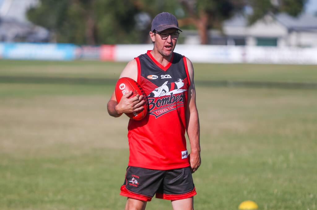 TAKING FLIGHT: New Cobden coach Adam Courtney put the Bombers through their paces at training on Monday. Picture: Morgan Hancock