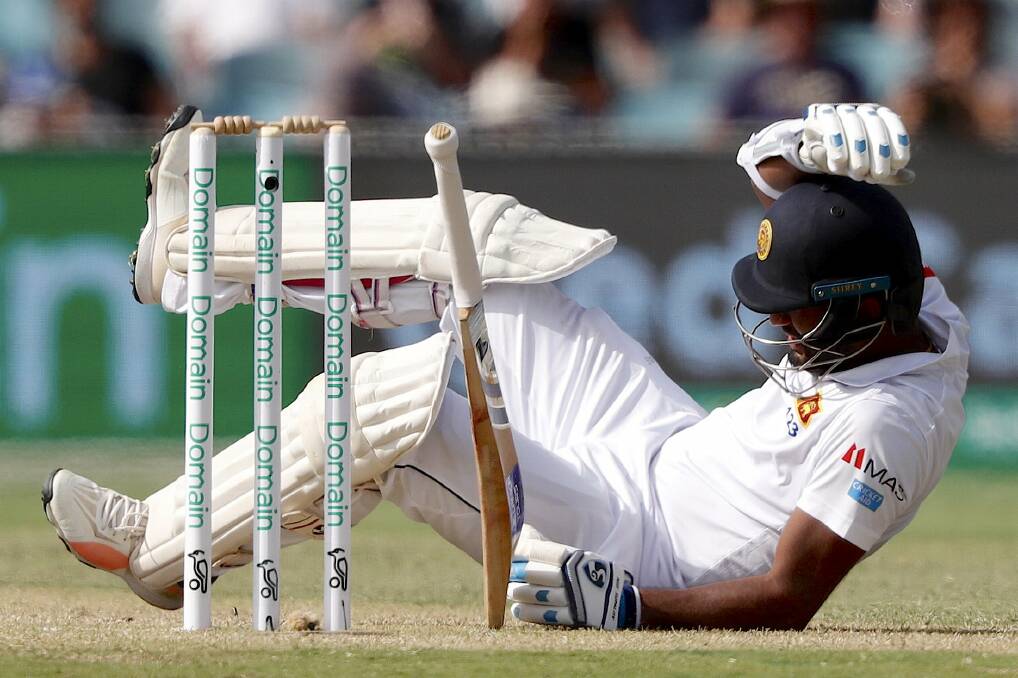 His driving is also questionable: Sri Lanka's Dimuth Karunaratne falls to the ground after being struck by a delivery by Australia's Pat Cummins during day two of the second Test match against Australia. 