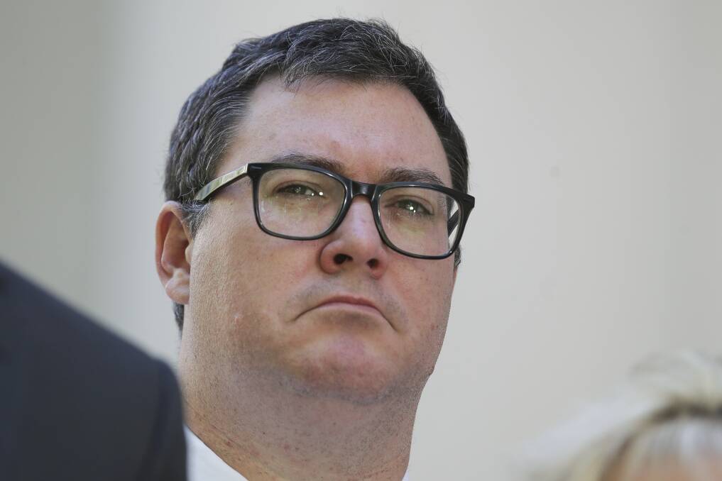 Happy days: Nationals MP George Christensen addresses the media during a doorstop interview.