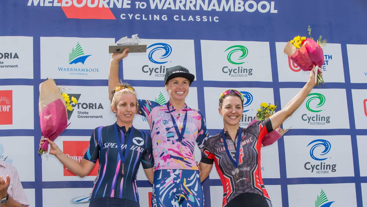 AS ONE: Women's placings Taryn Heather (second), Peta Mullens (winner) and Rebecca Wiasak (third) celebrate their wins. Picture: Christine Ansorge