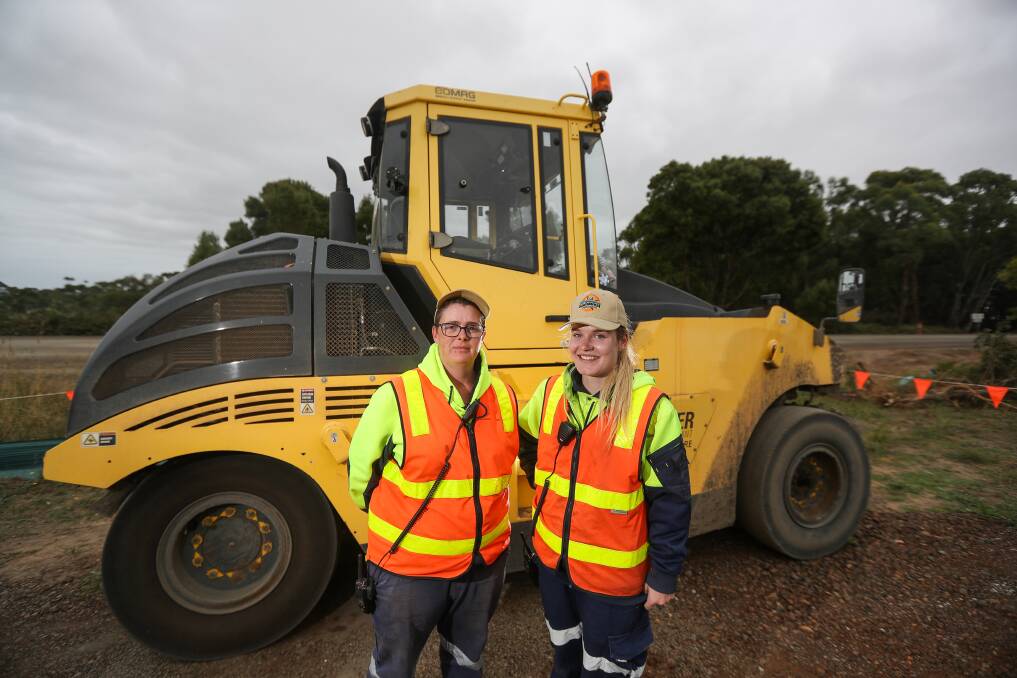 GREAT JOB: Southwest Traffic Control operations manager Anna Moloney and traffic controller Joss Retallack at a work site near Kennedy's Creek. Pictures: Morgan Hancock