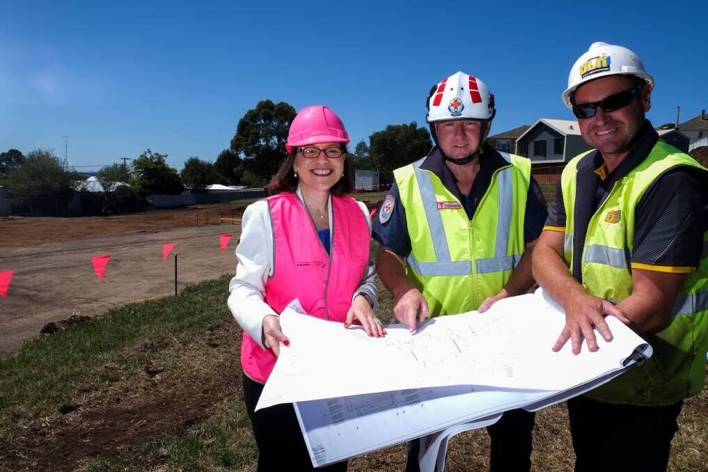 MOVING AHEAD: Victorian Health Minister Jenny Mikakos, Terang paramedic Allan Harvey and BDH Construction project manager Dave Janes check the plans for the new ambulance station in Terang. Picture: Rob Gunstone