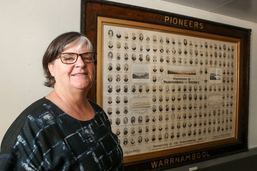 Fresh new look: Warrnambool Historical Society and Family History Group president Janet Macdonald in front of the restored Warrnambool Pioneers Board. Picture: Anthony Brady