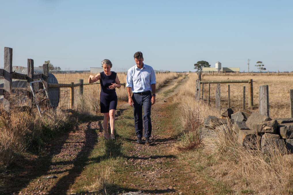 The long road: Federal energy minister Angus Taylor listens to Sisters dairy farmer Jill Porter during a visit. Picture: Rob Gunstone