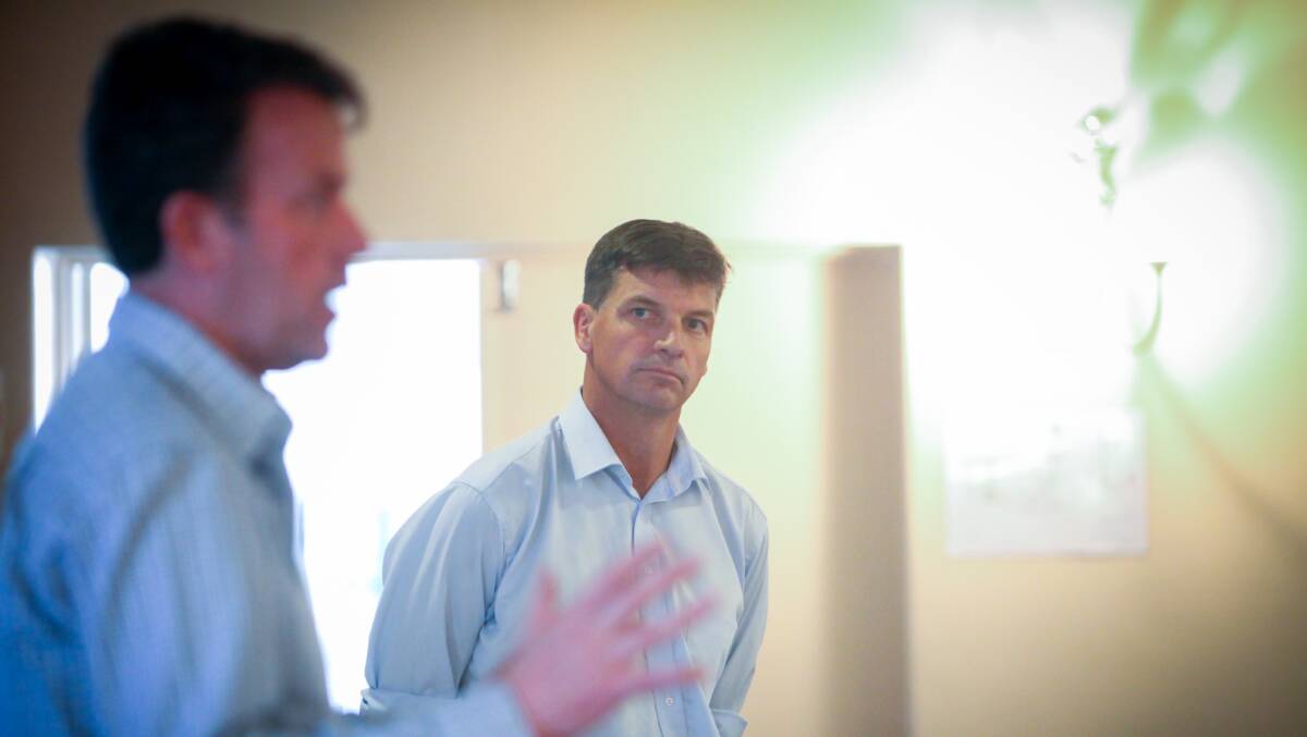 Powering on: Federal energy minister Angus Taylor watches as Member for Wannon Dan Tehan answers a question at the Terang community meeting. Picture: Rob Gunstone