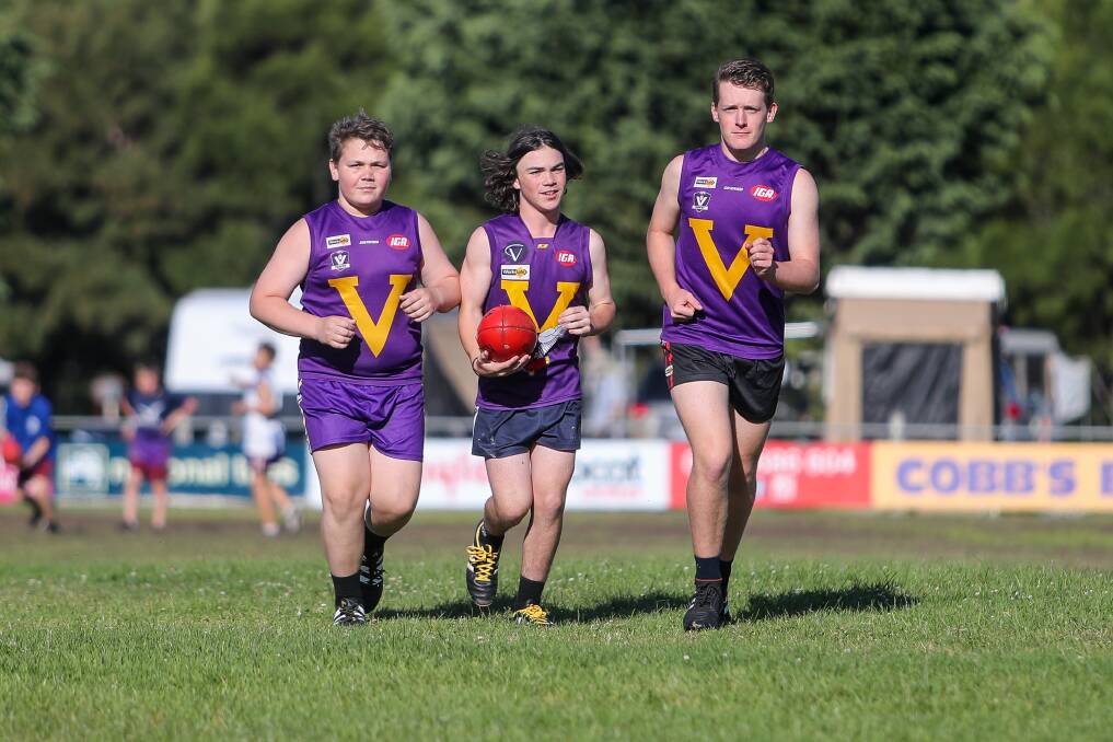 PURPLE PRIDE: Dru Dalton, Archie Lay and Riley Riordan play junior football at Port Fairy. They're part of the Sandy Robinson-coached under 16 team. Picture: Morgan Hancock