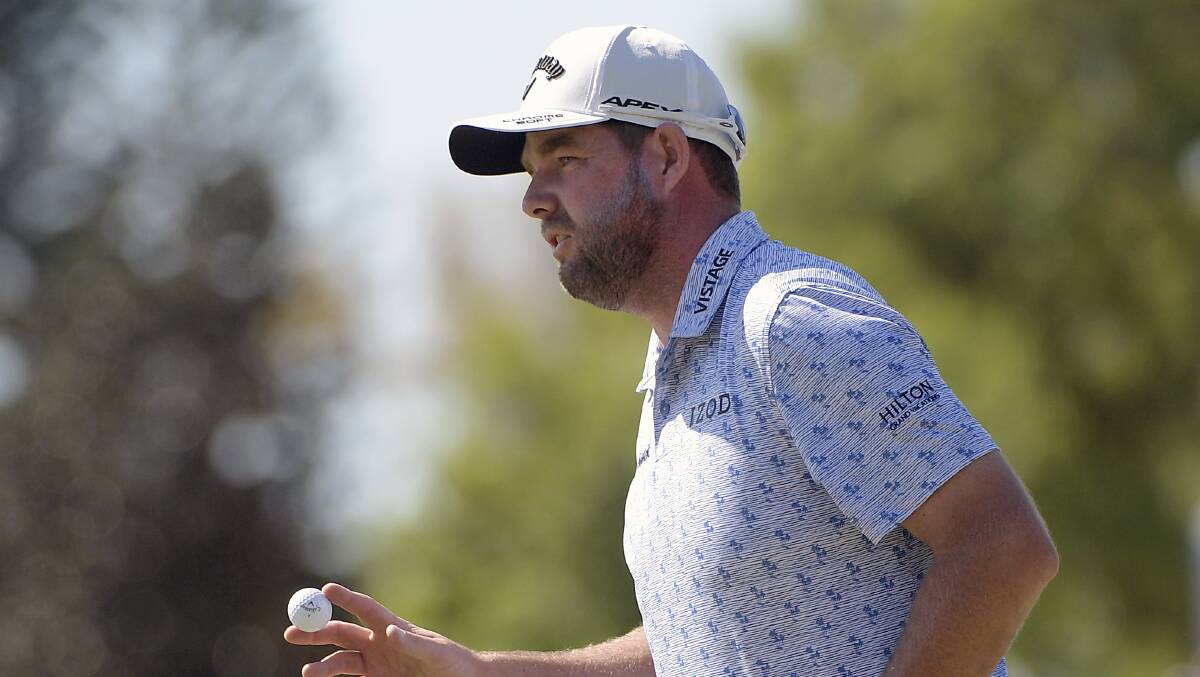 Marc Leishman acknowledges the crowd after making a putt on the second green during the second round of the Arnold Palmer Invitational. Picture: AP Photo/Phelan M. Ebenhack