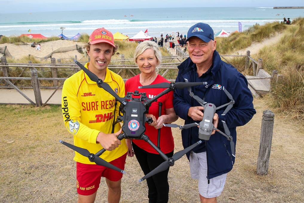 EYES IN THE SKY: Warrnambool Surf Lifesaving Club member Hamish McKendrick, Westpac Warrnambool branch manager Glenda Goldsworthy and Life Saving Victoria chief Nigel Taylor with one of the drones to be trialled. Picture: Anthony Brady 