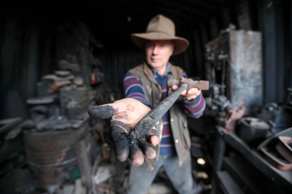  Garvoc sheep grazier Angus McGillivery in his container shed that was destroyed by the the St Patrick's Day 2018 fires. Picture: Rob Gunstone
