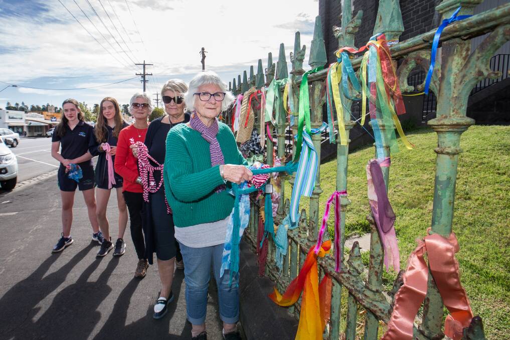 POWERFUL MESSAGE: Claire Drylie, Lizzie Gapes and Annie Macroe (front) and Warrnambool College students Lottie Reading and Elanora Williams inspect the ribbons at St Joseph's church. Picture: Christine Ansorge