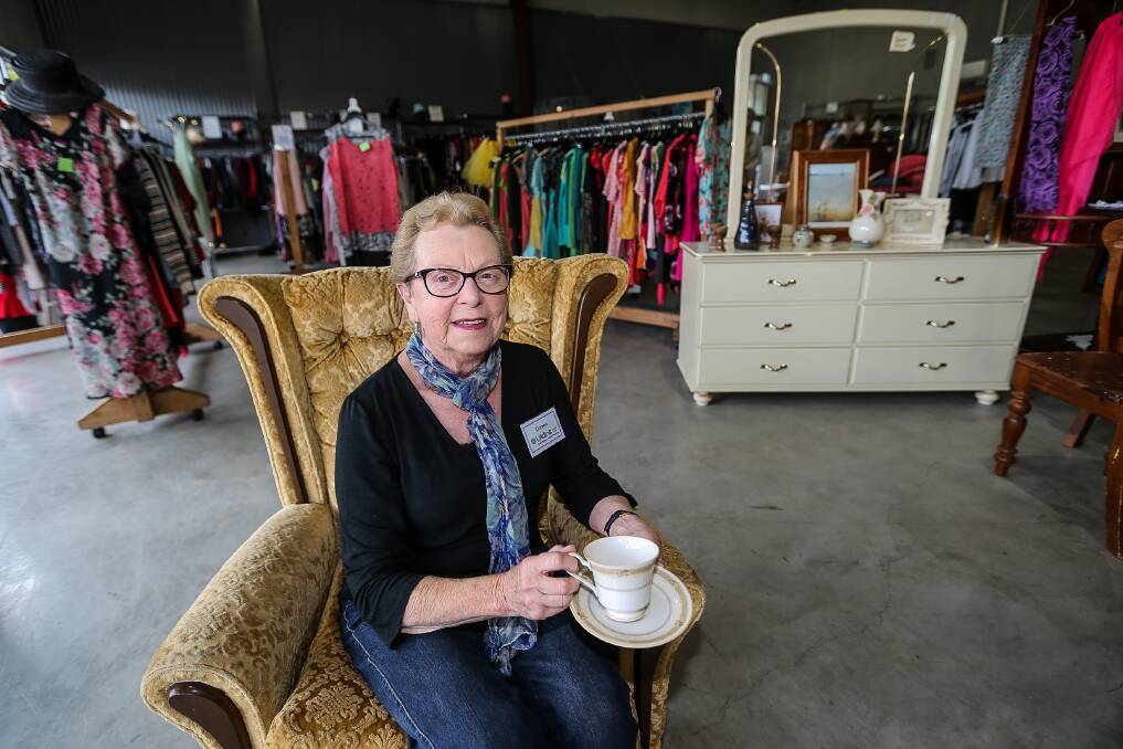 GREAT PIECES: Doreen FitzGerald from Lifeline Warrnambool sits on a retro chair. The shop is looking for more funky items. Picture: Anthony Brady