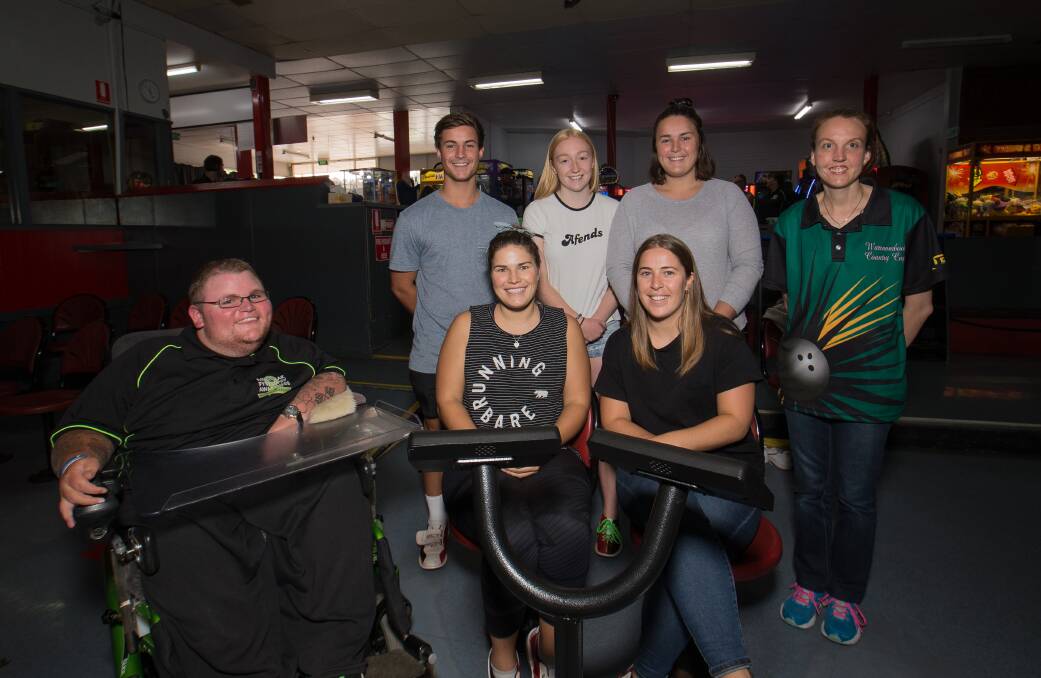 ALL SMILES: Organisers Chris Gillon and Bec Dixon with Sarah Robertson, Thalia Robertson, Christopher Robertson, Ebony Marris and Megan Robertson, who supported the worthy cause.  Picture: Christine Ansorge