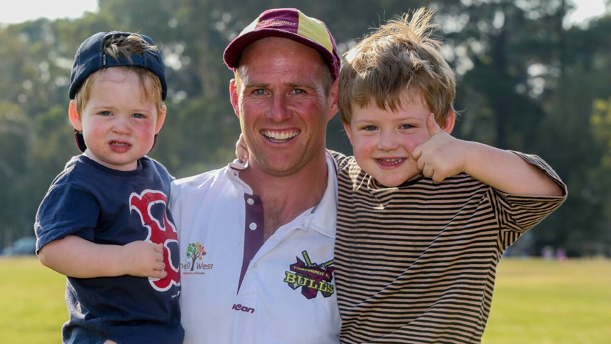 GOOD DAY OUT: Pomborneit's Brad Hillman with sons Billy and Jack after last year's South West Cricket Association grand final. Hillman took five wickets for 12 runs on Saturday. Picture: Anthony Brady