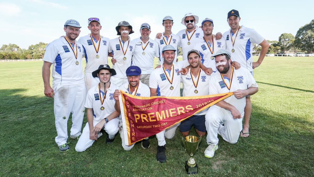 Hawkesdale players celebrate after winning the 2018-19 premiership, the second of their current three-peat. The Cats will move into the WDCA next season.