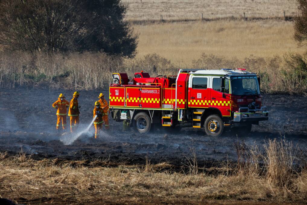 Blacking out: Warrnambool CFA members work to extinguish hot spots after a grass fire  at Yangery. Picture: Rob Gunstone