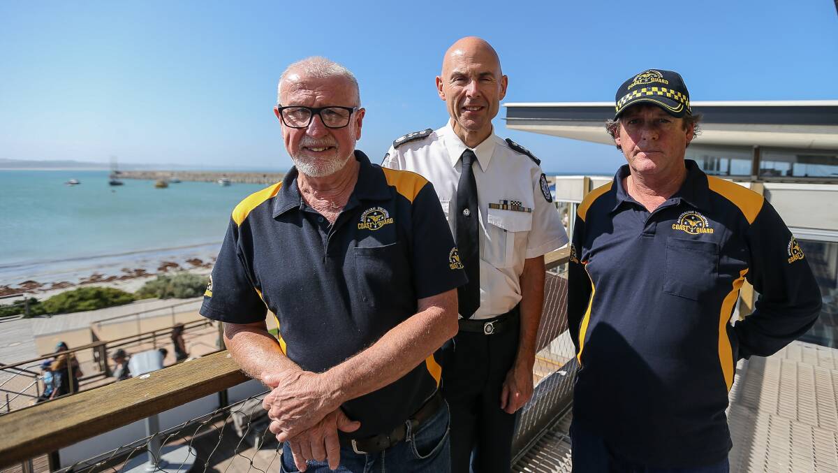 Emergency Management commissioner Andrew Crisp (middle) with Warrnambool Coast Gurad members Allan Wood and Mark Atkinson during his visit to Warrnambool. Picture: Anthony Brady