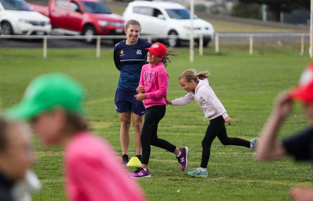 SPECIAL HELPER: Australian cricketer Georgia Wareham is all smiles during a WDCA clinic in Warrnambool on Monday. Picture: Morgan Hancock