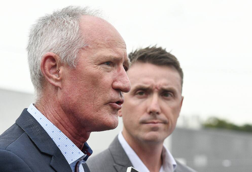 Thin defence: One Nation party officials Steve Dickson (left) and James Ashby field questions during a press conference in Brisbane.