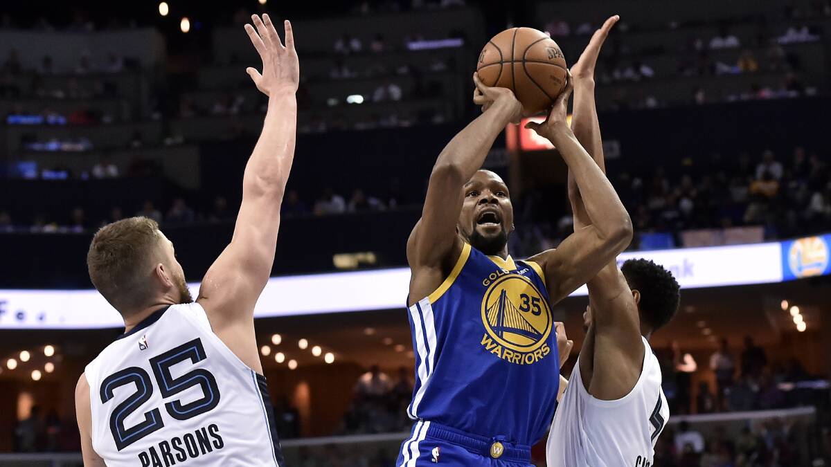 Golden State Warriors forward Kevin Durant (35) shoots between Memphis Grizzlies forwards Chandler Parsons (25) and Bruno Caboclo during the second half.