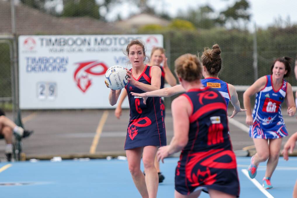 Next option?: Timboon Demons centre Mellissa McKenzie looks to pass the ball to a teammate.
